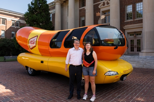 Schmitt with Doug Hicks in front of Wienermobile