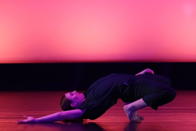 a young woman dancing on a stage