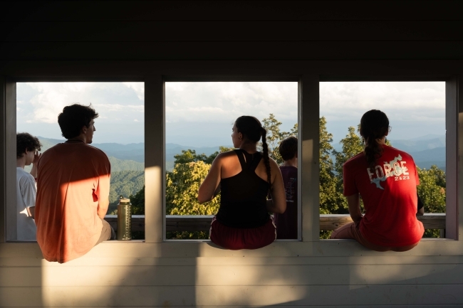 students taking a break enjoying the view during Davidson Outdoors trip