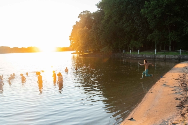 students swimming during davidson outdoors trip at the lake