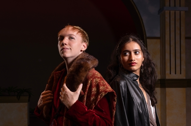 a young man and a young woman in Shakespearean outfits