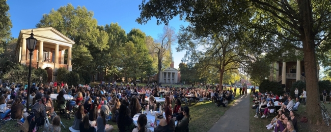 a scene from the Phi-Eu Debate where people are sitting and listening