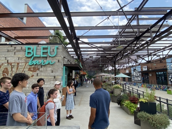 sustainability scholars at camp north end outside Bleu Barn