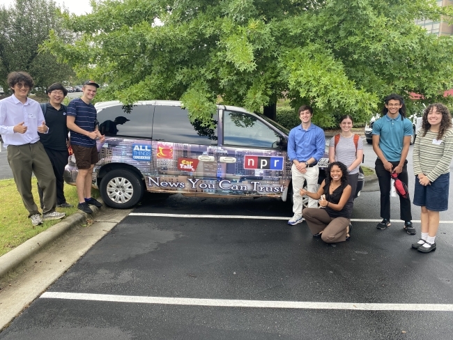 sustainability scholars in front of van