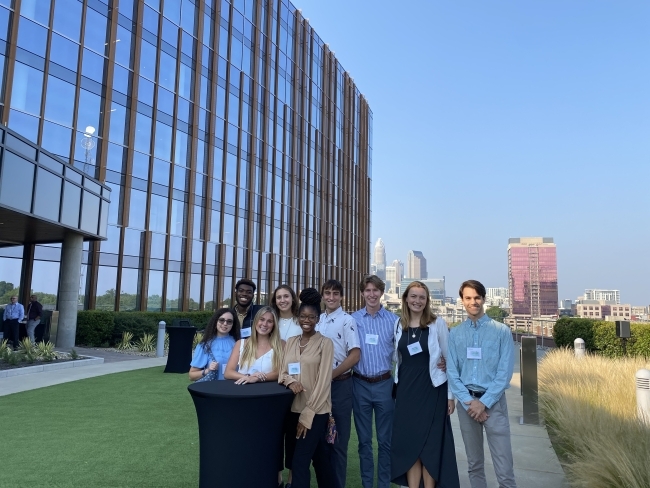 Group of Sustainability Scholars in front of city building