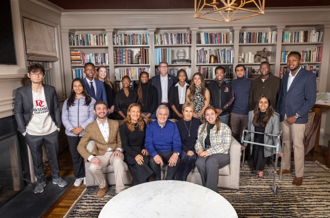 a group of young people with adults in a library