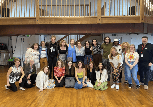 a group of students together in an old theatre