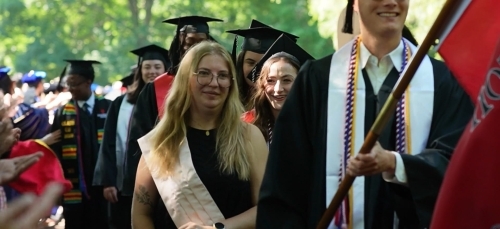 Commencement 2025 Backplate students in procession during ceremony