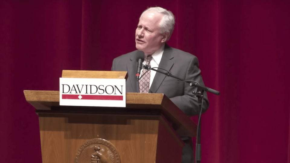 Kristol at podium speaks to crowd