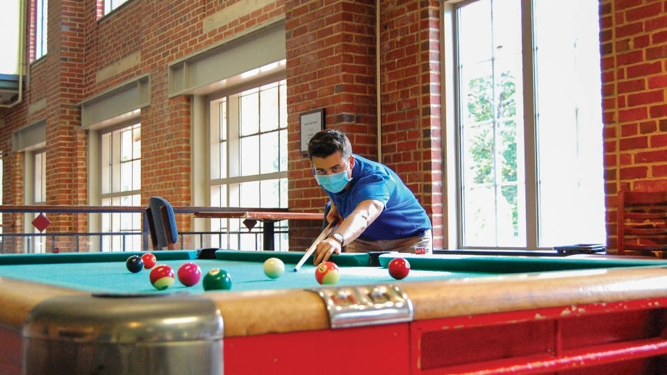 Student Plays Pool with Mask On