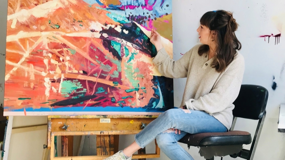 Adelle Patten with a painting