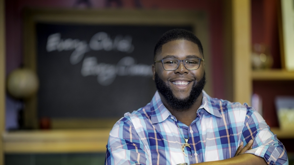 Tony jack in front of C]chalkboard