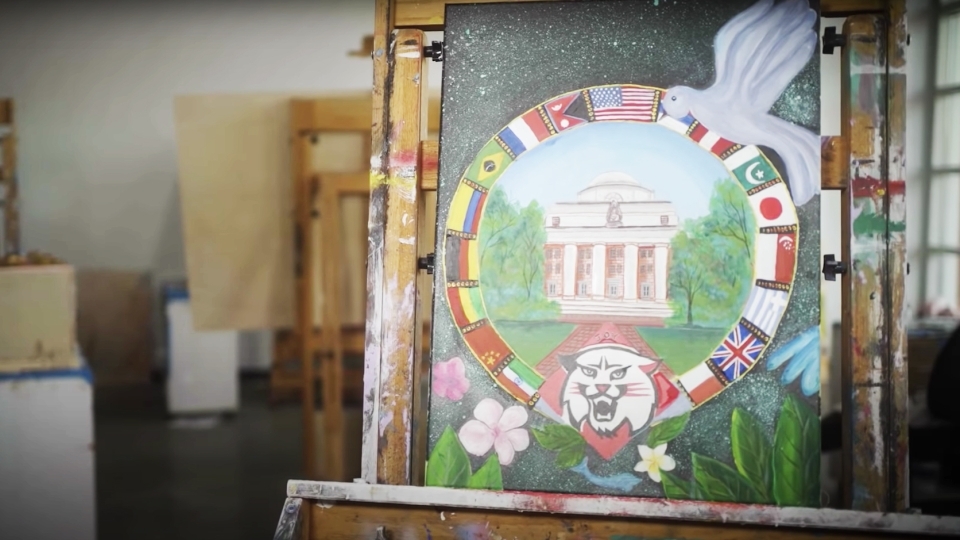 Student painting in the 2021 holiday video