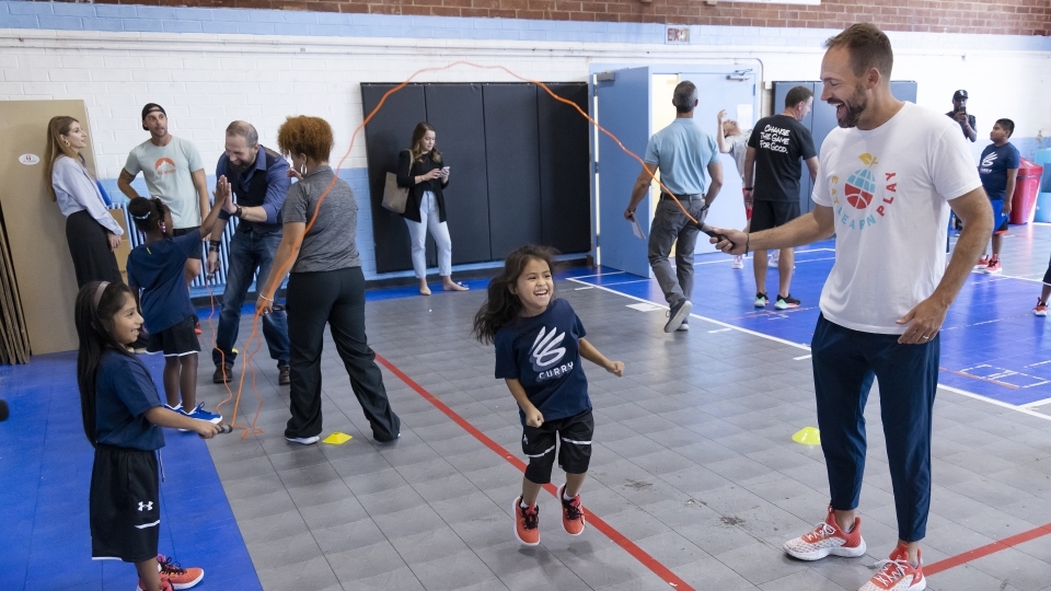 Athletes and students playing at Ada Jenkins Center