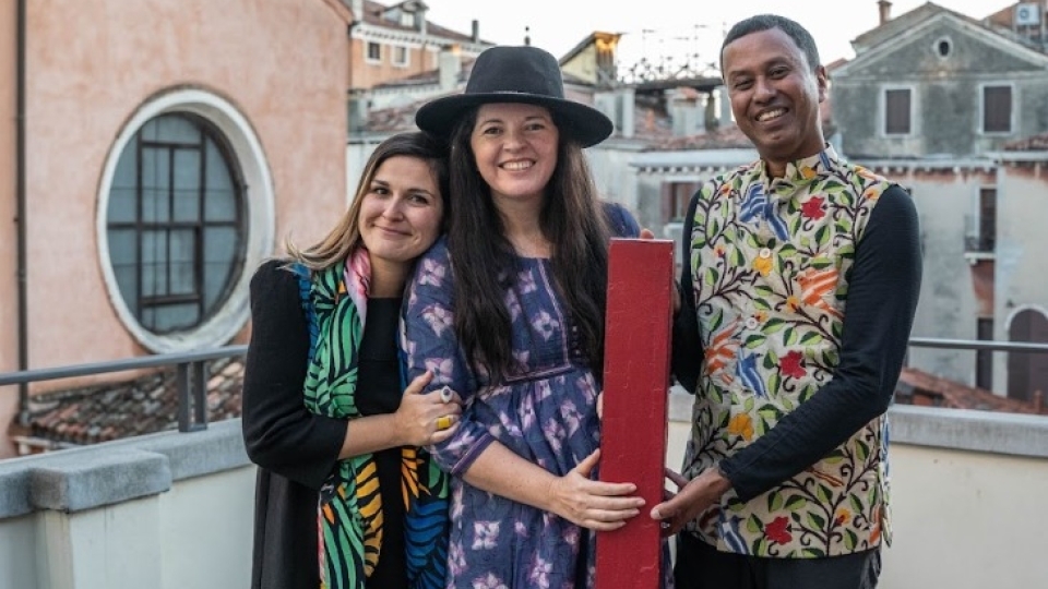 Co-curators Jennifer Garcia Peacock (center) and Subhankar Banerjee with Lucia Pedrana, head of university relations, European Cultural Centre, Venice, celebrate their award for A Library, a Classroom, and the World, at a Nov. 27 ceremony. 