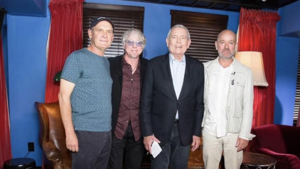 Bertis (left) joined R.E.M. (pictured are Mike Mills and Michael Stipe) on a promo tour. The photo was taken after an interview with Dan Rather, circa 2018.