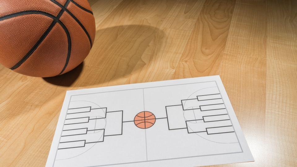 Image of basketball and brackets sheet for March Madness