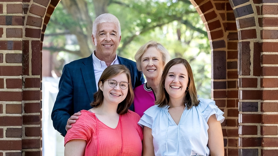 a white family consisting of a male, female and their daughters