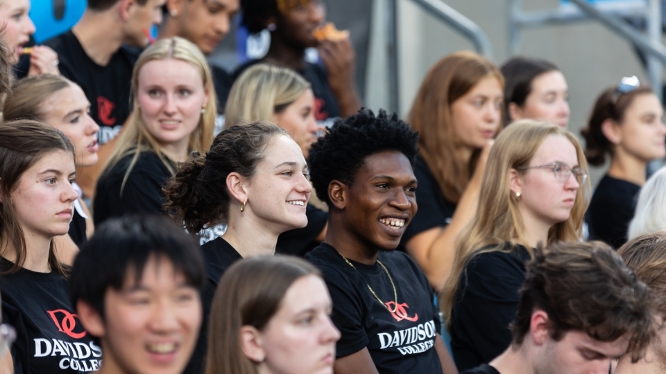 Students smiling at the Charlotte FC game