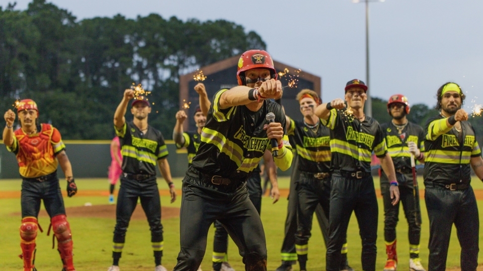 Parker Nolan ’22 with the Firefighters Baseball Team holding sparklers