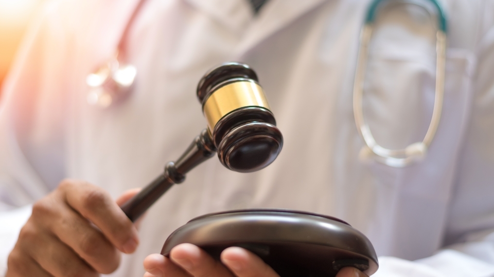 a doctor holding a gavel