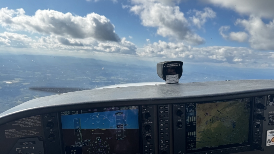 a view from a plane's cockpit on a sunny day