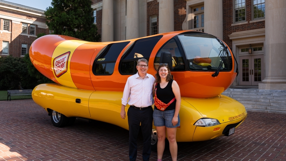 Schmitt with Doug Hicks in front of Wienermobile