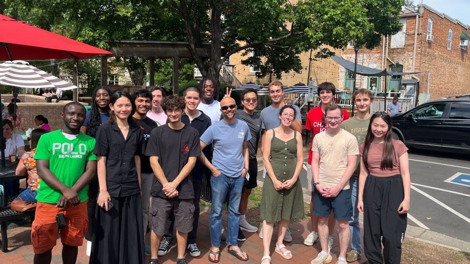 Student researchers outdoors with Professors