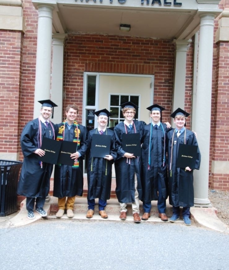 a group of students in commencement robes