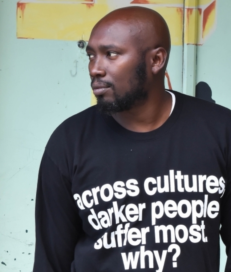 a young Black man wearing a sweatshirt