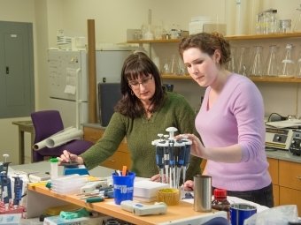 Prof. Bernd Safer Smokes Research in Lab w Student