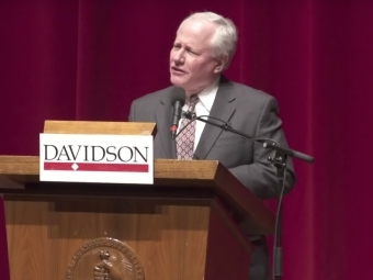 Kristol at podium speaks to crowd