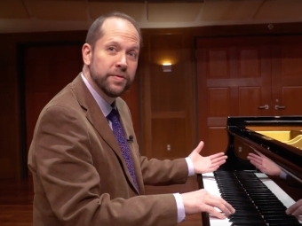 Neil Lerner playing music on the piano