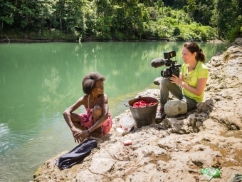 Mary Olive Smith Shooting Documentary with Woman Smiling