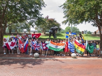 International Students with Flags from Various Countries by Bronze Wildcat