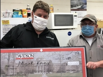 Mark Knox and David Holthouser with $1,000 prize check