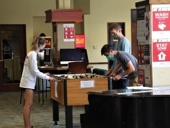 Students Play Foosball in Masks