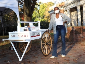 Student by the Art Cart