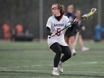 Olivia Carey playing lacrosse