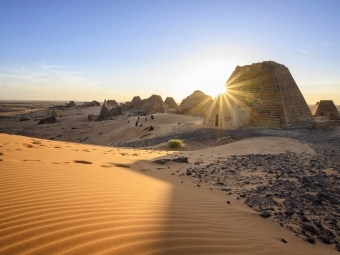 Matt Stirn - Sudanese students play and relax amongst pyramids at Meroë, the royal necropolis of the Kingdom of Kush