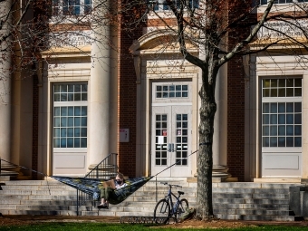 Campus Scenes Student in hammock with bicycle