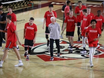 Davidson College men's basketball team on court with head coach Bob McKillop