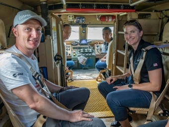 Training Vehicle with Astronauts in it—two in cabin, two outside