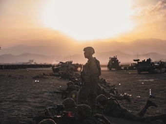 Matthew Hardman in Army Gear Among Sand