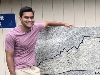 Tim Schietroma '25 in front of a map of North Carolina