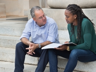 Prof. Samuel Sánchez y Sánchez converses with student