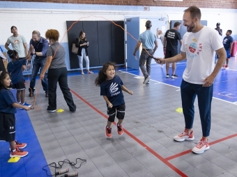 Athletes and students playing at Ada Jenkins Center