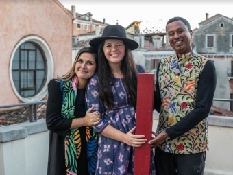 Co-curators Jennifer Garcia Peacock (center) and Subhankar Banerjee with Lucia Pedrana, head of university relations, European Cultural Centre, Venice, celebrate their award for A Library, a Classroom, and the World, at a Nov. 27 ceremony. 