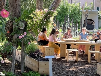 Dr. Jennifer Garcia Peacock, Dr. Annie Merrill, and six students of the Environmental Justice Art class from Davidson College; in the outdoor classroom of a Library, a Classroom, and the World, Marinaressa Garden, Venice Biennial Art exhibition Personal Structures: Reflections, Venice, Italy (photo by Subhankar Banerjee, May 2022).