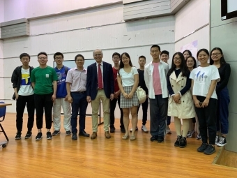 Professor standing with students in group